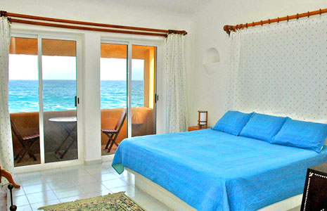 Master bedroom looking out to the bright blue Caribbean Sea