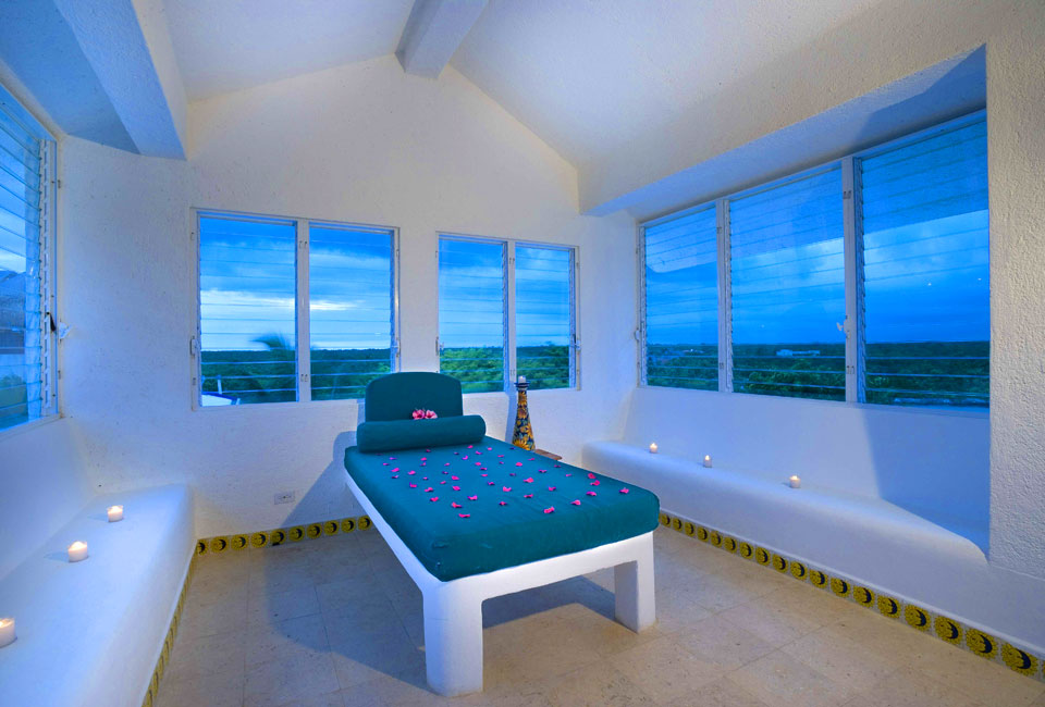 Huge windows looking out to an incredible view from your bedroom in Akumal